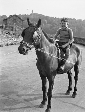 BOY ON HORSEBACK